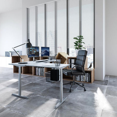 L-shaped standing desk ergonomic office setup VersaDesk adjustable workstation