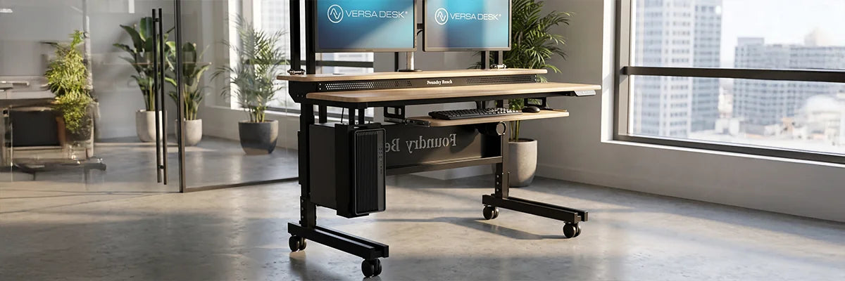 VersaDesk standing desk frame with dual-motor legs and reinforced crossbar demonstrating superior stability in modern office