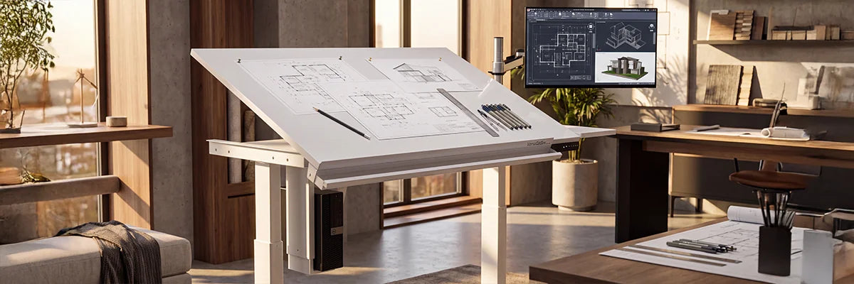 White VersaDesk electric drafting table with tilted surface holding architectural blueprints, pencils and ruler, CAD monitor on arm mount in modern design studio with warm natural light