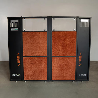 Versa Office black-framed room divider panel with burnt orange acoustic fabric inserts.