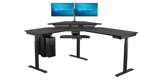 Professional trading workstation with electric standing desk and monitor setup