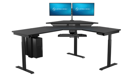 Gaming workstation with electric standing desk and immersive monitor setup