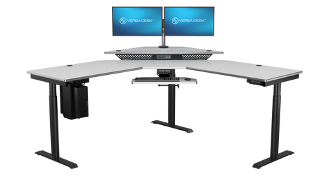 Luxury corner workspace with electric sit stand desk and monitors
