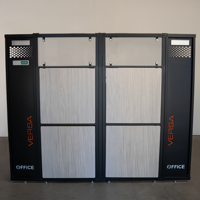 Versa Office cubicle panel system with light woodgrain laminate inserts.